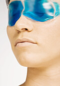 Woman wearing eye mask, close-up