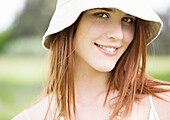 Young woman wearing sun hat