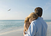 Couple hugging on beach