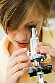 Boy using microscope, close-up