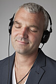 A man listening to headphones