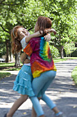 Sister hugs in the park