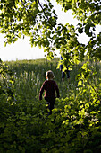 View of two boys walking up a hill