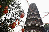 A pagoda and hanging Chinese lanterns, Guangzhou, China