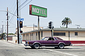 Car passing motel in Los Angeles, California