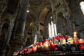 Lit votive candles in the Basilica Notre Dame De Fourviere, Lyon France