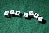 Lettered cubes spelling the words BAD IDEA