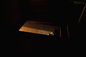 Dark attic with light seen through door