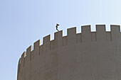 Modern security camera placed on old arabesque fort
