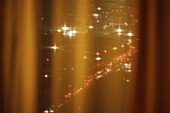 Busy streets of Jakarta, Indonesia seen through a curtain