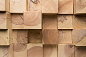 A grid of wooden blocks arranged in varying lengths