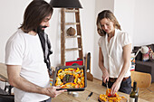 Couple preparing pumpkin dish at home