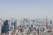 Tokyo Tower and cityscape against clear sky