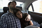 Young couple relaxing in car