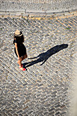 Girl seen from the cathedral tower, Faro, Algarve, Portugal