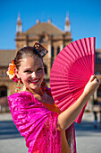 Young woman from Flamenco Fuego dance group on Plaza de Espana (MR), Seville, Andalusia, Spain