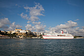 Cruise ship MS Deutschland (Reederei Peter Deilmann) approaching Mahon pier, Mahon, Menorca, Balearic Islands, Spain
