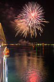 Fireworks illuminating the harbour in celebration of the inaugural visit of cruise ship MS Deutschland (Reederei Peter Deilmann) to Pozzuoli, Pozzuoli, Campania, Italy