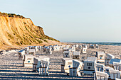 Roofed wicker beach chairs at beach, Rotes Kliff, Strandkörbe am Strand, Rotes Kliff, Kampen, Sylt, Schleswig-Holstein, Deutschland