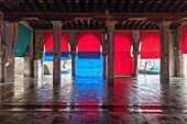 red awnings at empty Rialto fish market, Mercato di Rialto, Venice, Italy