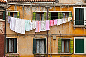 typical, washing line strung outside window above canal, Castello, Venice, Italy