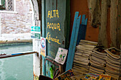 Luigi Frizzo, bookshop Libreria Acqua Alta, piles of books, canaö, emergency exit, Venice, Italy