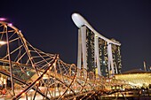 Helix Bridge and Marina Bay Sands Hotel at night, Singapore.