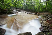 'Franconia Notch State Park - The Pemigewasset River just in the area of ''The Basin'' viewing area in Lincoln, New Hampshire USA during the spring months.'