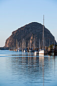 California, Morro Bay, Sailboats Docked In Harbor, Morro Rock In Distance.
