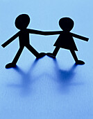 Male And Female Paper Dolls Holding Hands, Blue Background