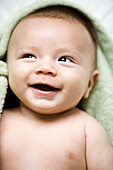 Close Up Of A Two Month Old Baby Boy Laughing