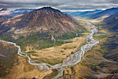 Aerial of the Okokmilaga River flowing north out of the Brooks range, through the Gates of the Arctic National Park, Arctic Alaska.