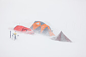 Base camp on the Ruth glacier, Alaska range, during snowstorm, interior, Alaska.