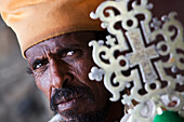 'Orthodox priest with ceremonial cross; Ethiopia'