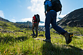 'Walkers going up a path to the Black Cuillin; Isle of Skye, Scotland'