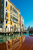 'Buildings along the shoreline of the Grand Canal viewed from a boat; Venice, Veneto, Italy'