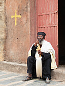 'Ethiopian Orthodox priest with cross, Wukro Chirkos rock cut church; Wukro, Tigray region, Ethiopia'