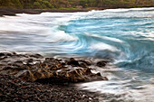 Hawaii, Maui, Hana, A soft slow view of ocean waves crashing on black lava rock