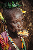 'Elderly Surma woman with traditional lip plate, Omo region, Southwest Ethiopia; Kibish, Ethiopia'