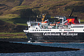 'Caledonian MacBrayne ferry, going along narrow channel between mainland and Kerrera Island having just left Oban port; Oban, Argyll and Bute, Scotland'