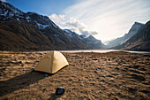 Tent with scenic mountain background while wild camping at Horseid beach, Moskenes??y, Lofoten Islands, Norway