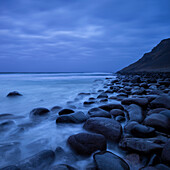 Coastal rocks in water at Unstad beach, Vestv?•g??y, Lofoten Islands, Norway