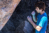 Male prepares for rock climbing on Mt.Evans in Colorado