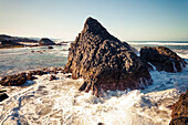 Large waves smash agains rock outcroppings a Seal Rock Beach, Oregon.