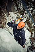 A man ice climbing near Whistler, BC, Canada.