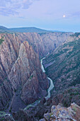 Moonset over the Gunnison River and the Black Canyon of the Gunnison National Park near Montrose, Colorado.