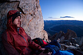 A climber greets the sunrise from the summit of Cerro Madsen in Argentina's Los Glaciers National Park.