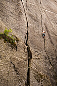 Italian climber trad climbing a crack route in Esigo, Ossola, Italy. Ossola is one of the main destination in Europe for crack climbing.
