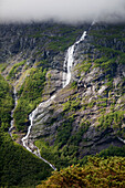 'A stream running down a mountain with dense cloud; Andalsnes, Rauma, Norway'