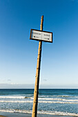 'Sign on the beach for windsurfing and bathrooms; Tarifa, Cadiz, Andalusia, Spain'
